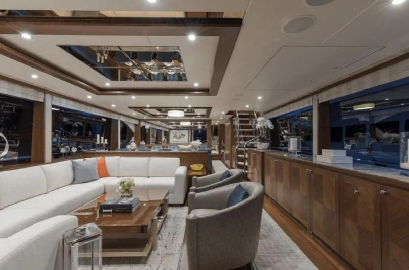 a living room with a couch and a table aboard FAR NIENTE Yacht for Sale