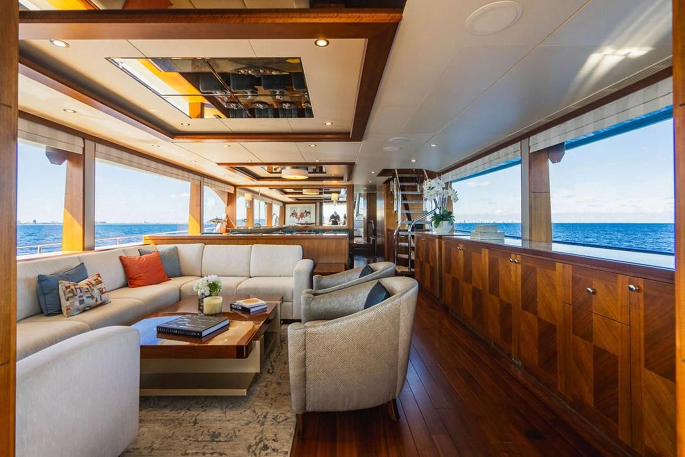 a living room with a couch and a table aboard FAR NIENTE Yacht for Sale