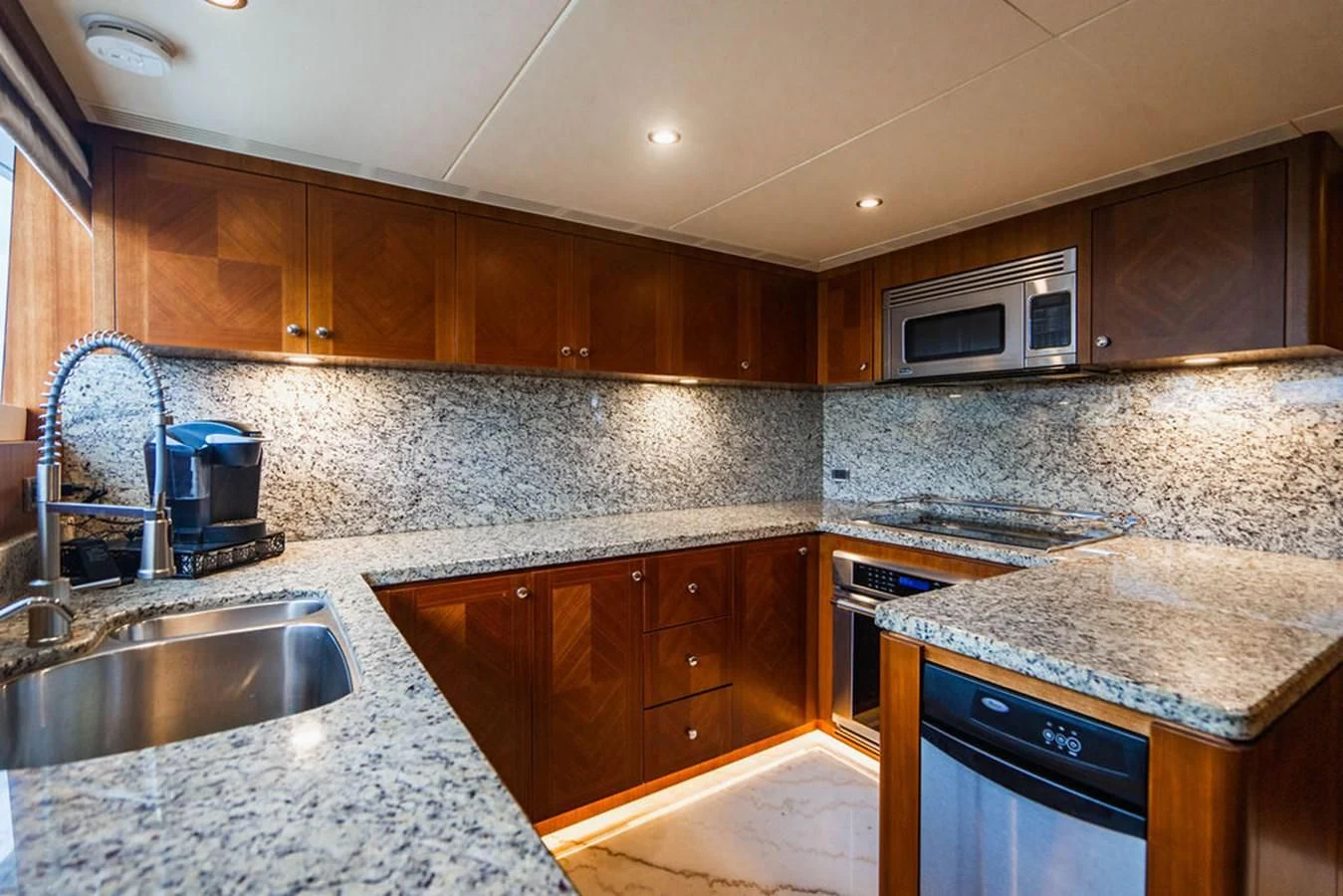 a kitchen with granite counter tops aboard FAR NIENTE Yacht for Sale