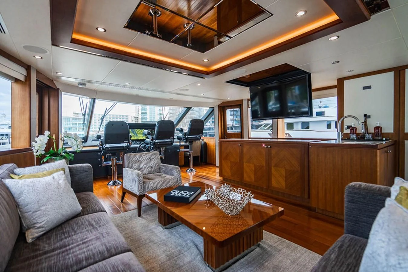 a living room with a couch and a coffee table aboard FAR NIENTE Yacht for Sale