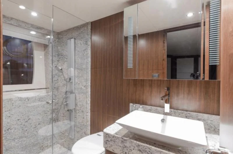 a bathroom with a glass shower aboard FAR NIENTE Yacht for Sale