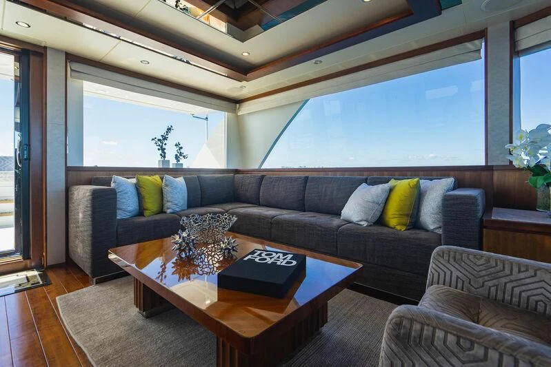 a living room with a couch and a coffee table aboard FAR NIENTE Yacht for Sale
