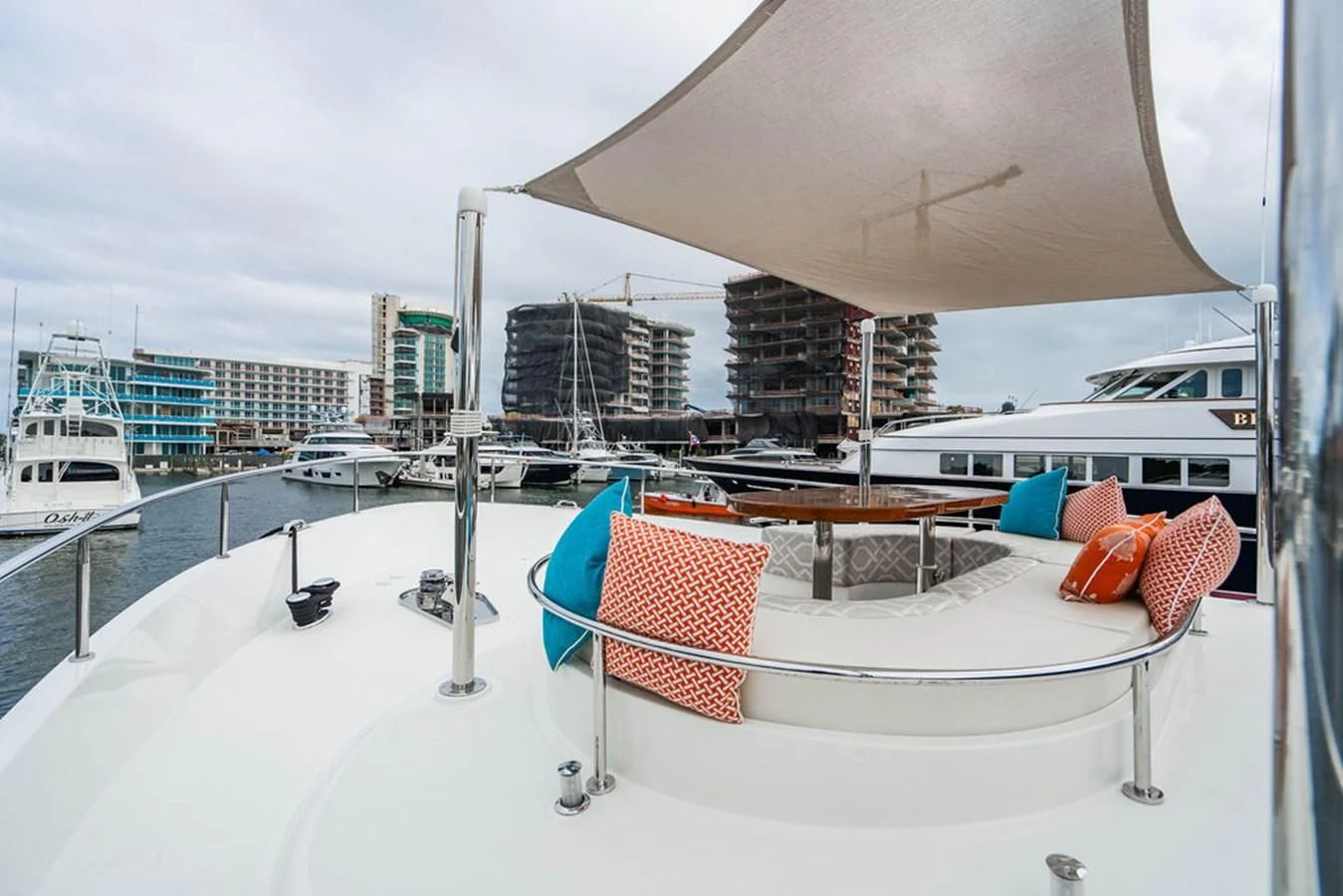 a covered patio with a table and chairs on it aboard FAR NIENTE Yacht for Sale