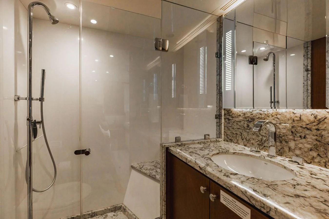 a bathroom with a shower and sink aboard FAR NIENTE Yacht for Sale