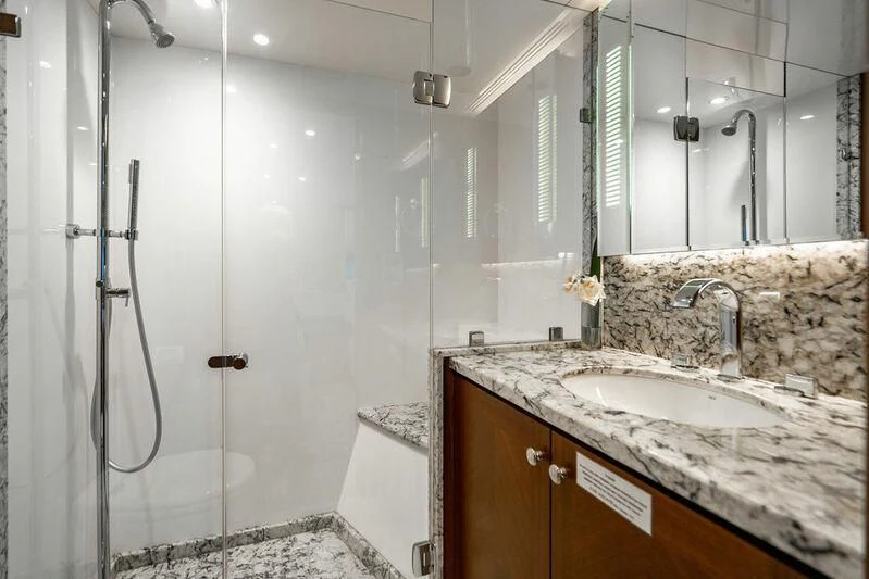 a bathroom with a shower and sink aboard FAR NIENTE Yacht for Sale