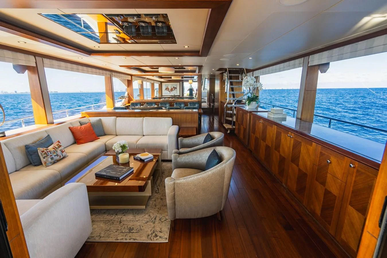 a living room with a large window aboard FAR NIENTE Yacht for Sale