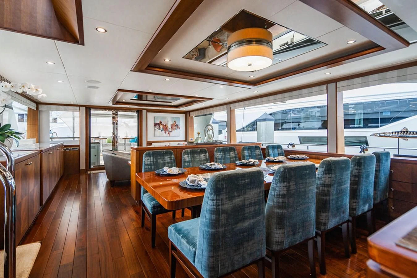 a large dining room with a large table and chairs aboard FAR NIENTE Yacht for Sale