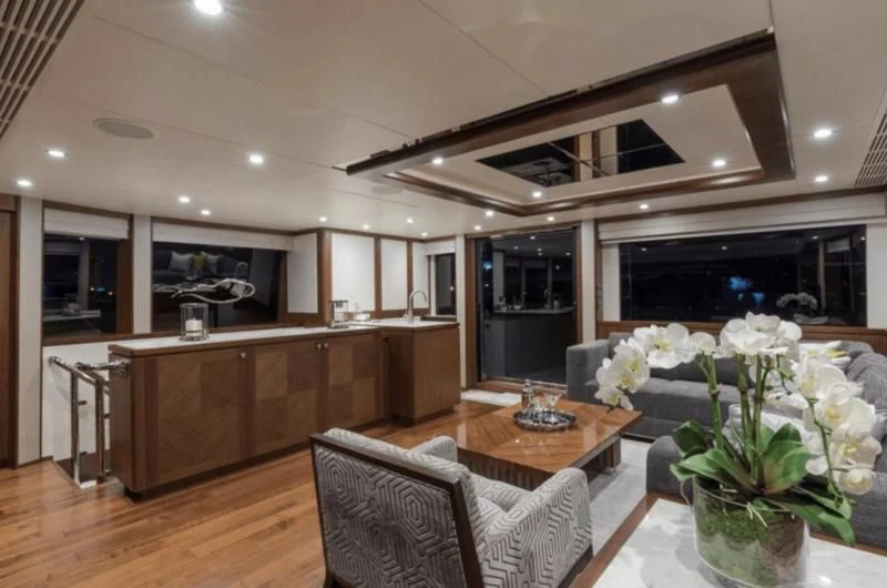 a large kitchen with a table and chairs aboard FAR NIENTE Yacht for Sale