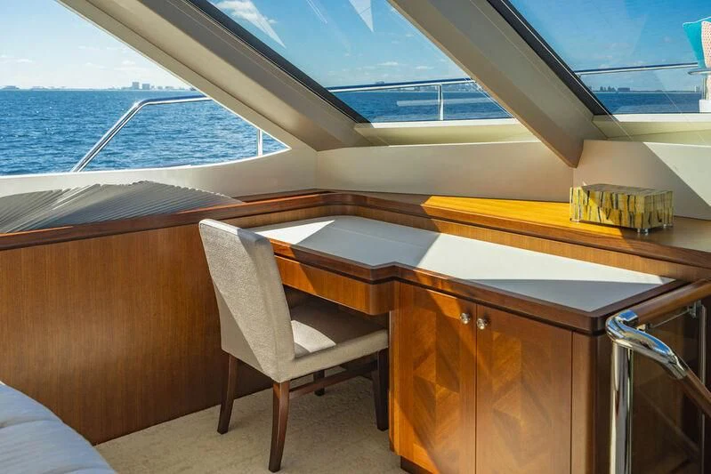 a room with a table and chairs aboard FAR NIENTE Yacht for Sale