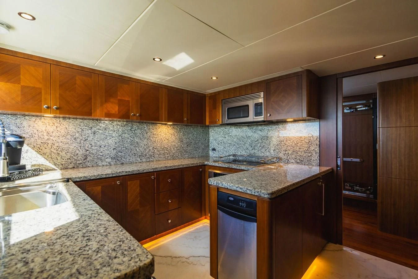 a kitchen with marble counters aboard FAR NIENTE Yacht for Sale