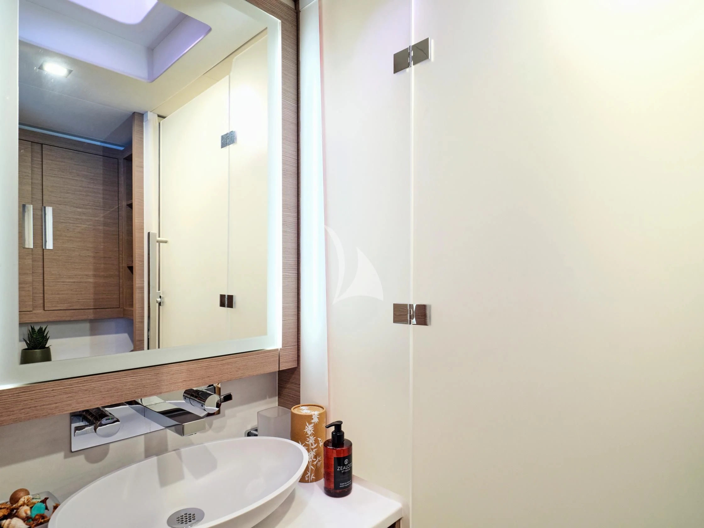 a bathroom with a mirror aboard PIXIE Yacht for Charter