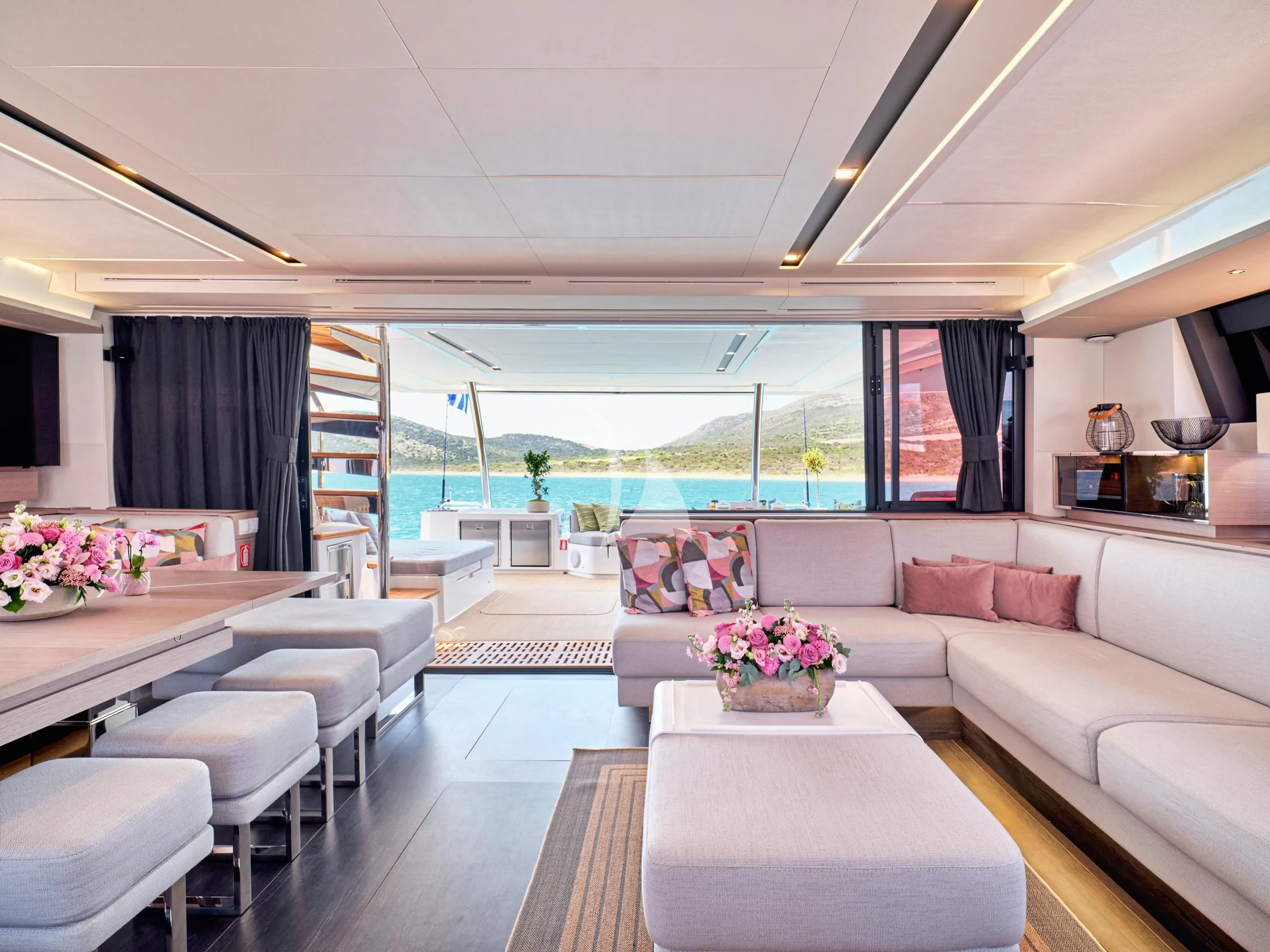 a living room with a large window aboard PIXIE Yacht for Charter