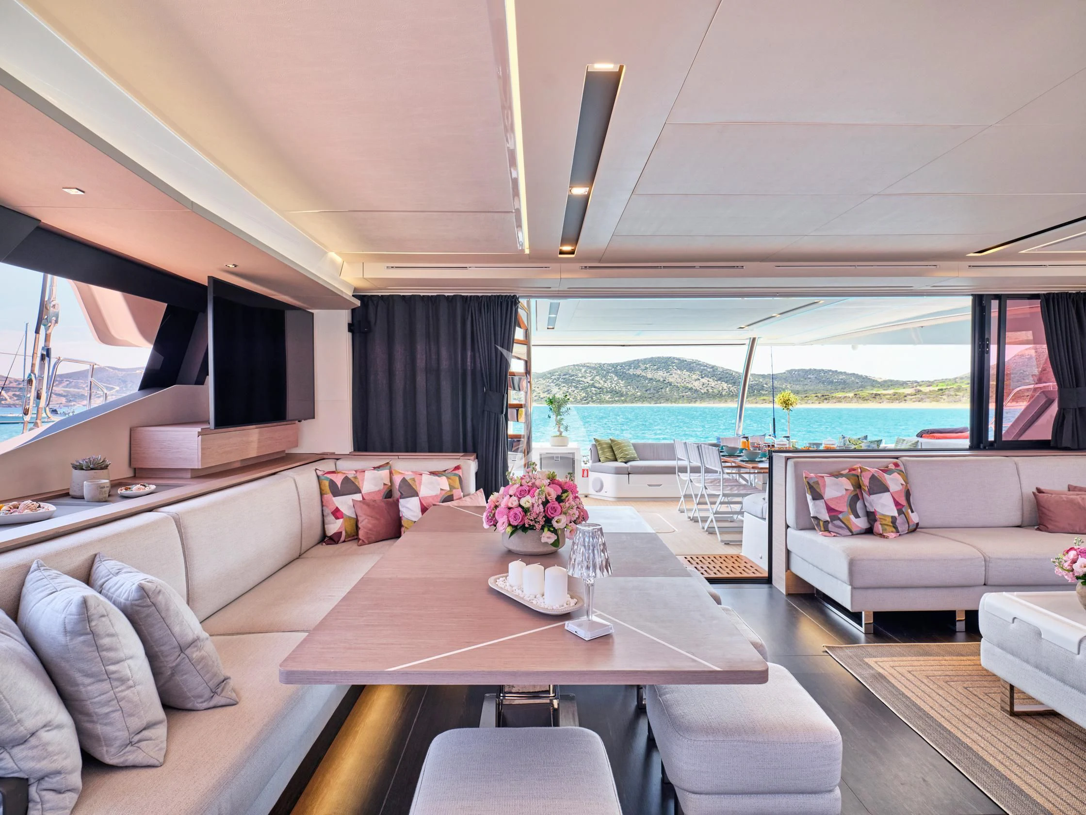 a living room with a large window aboard PIXIE Yacht for Charter