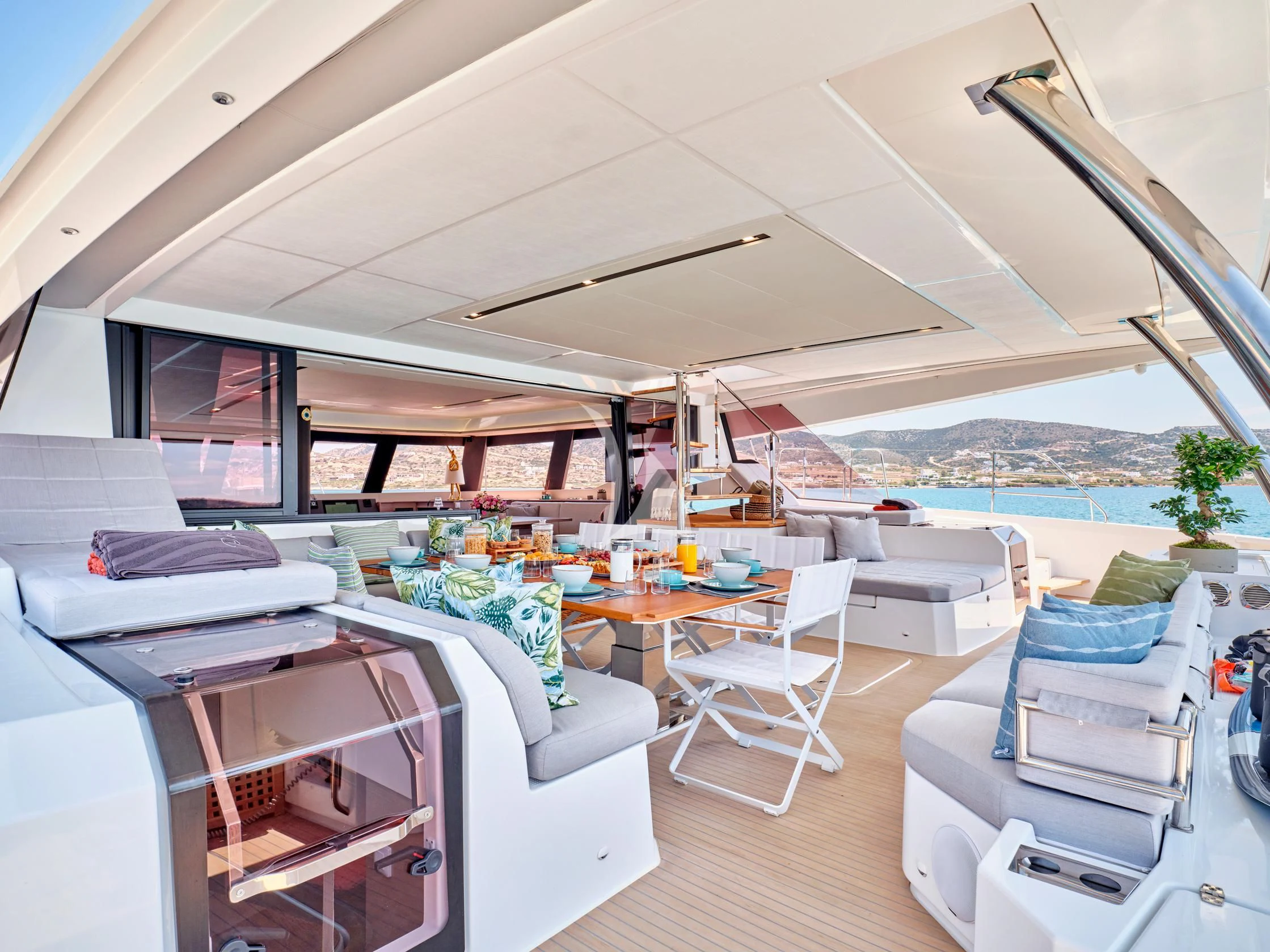 a room with a couch and a table and chairs aboard PIXIE Yacht for Charter