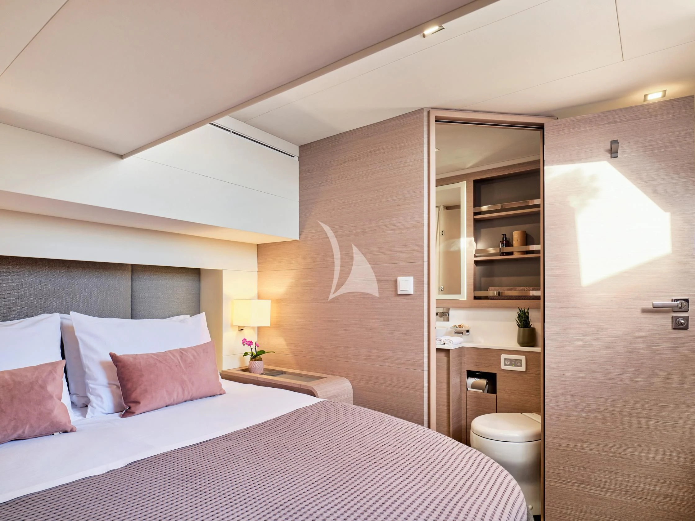 a bedroom with a bed and a shelf aboard PIXIE Yacht for Charter