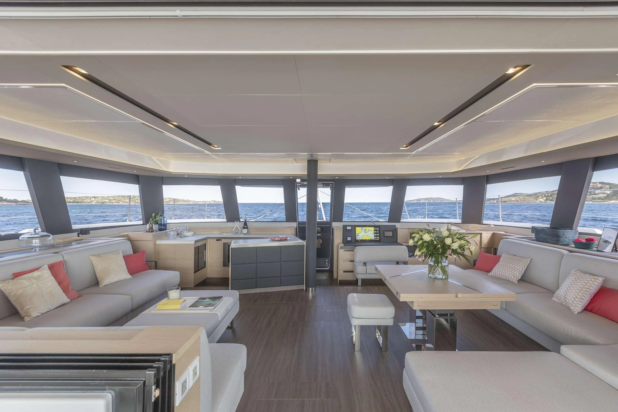 a room with a couch and a table and a window aboard PIXIE Yacht for Charter
