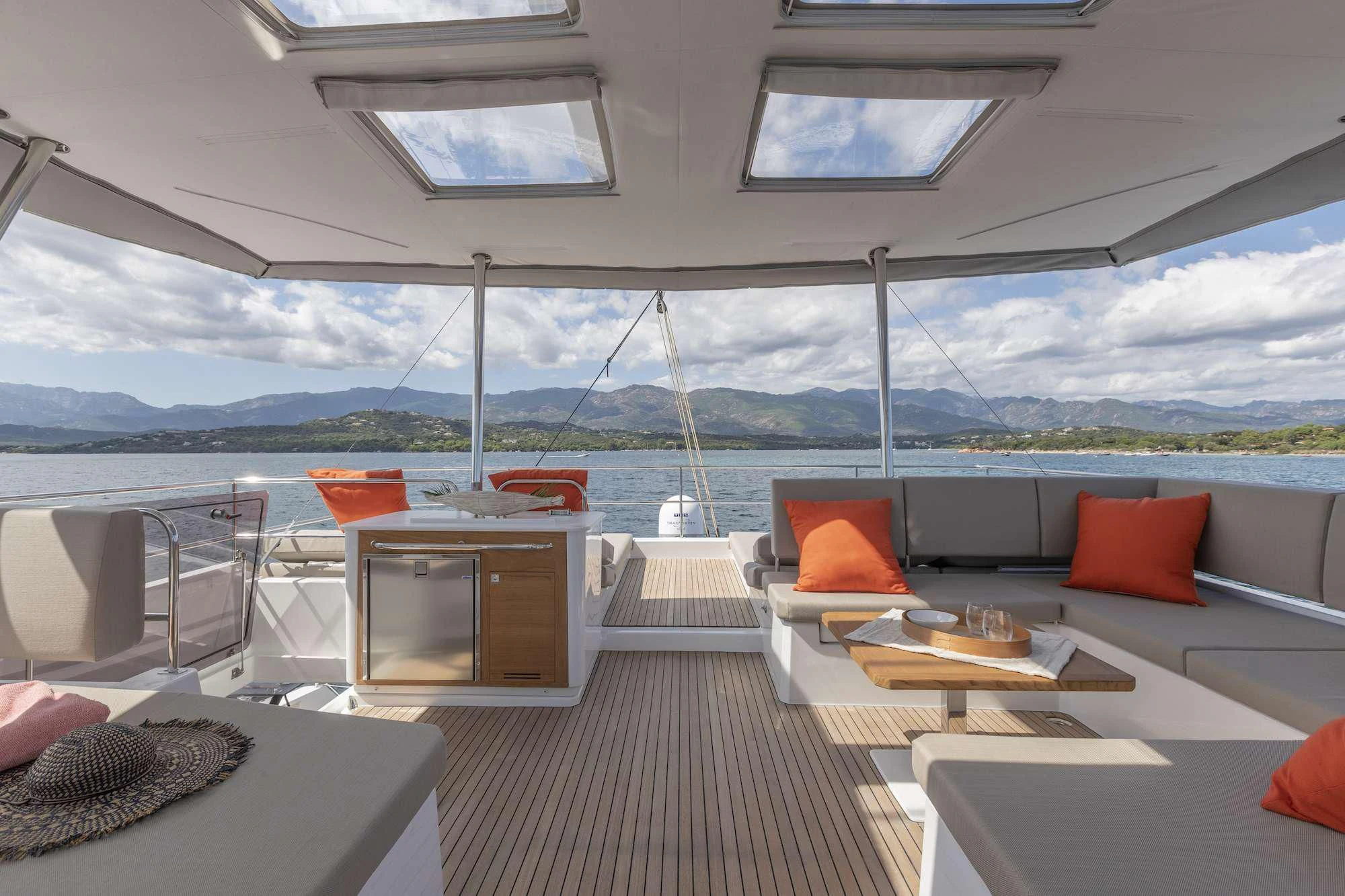 a room with a couch and a table and chairs aboard PIXIE Yacht for Charter