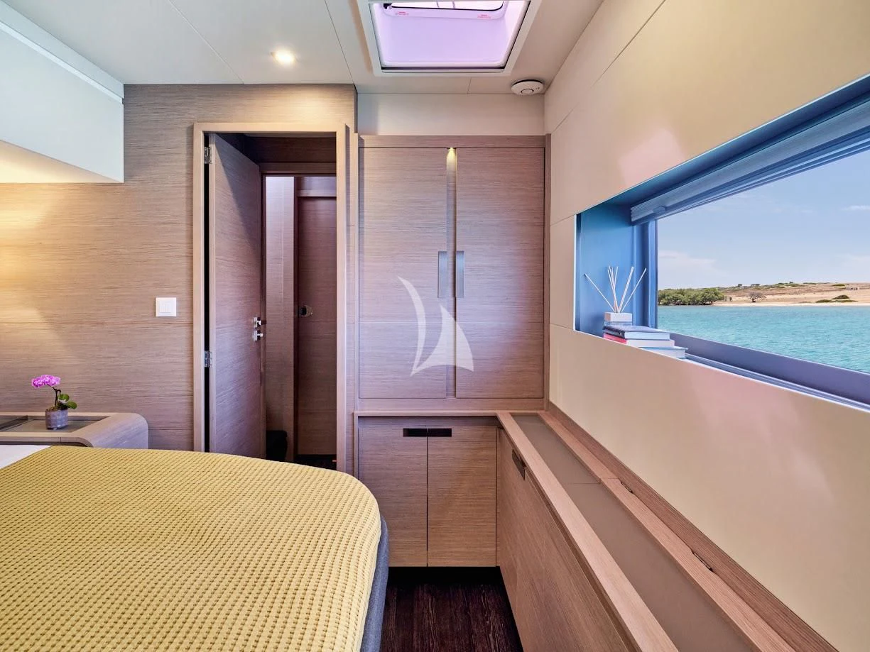 a room with a table and a window aboard PIXIE Yacht for Charter