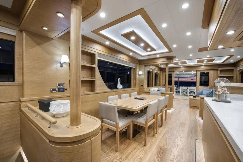 a large room with tables and chairs aboard EMPIRE Yacht for Sale