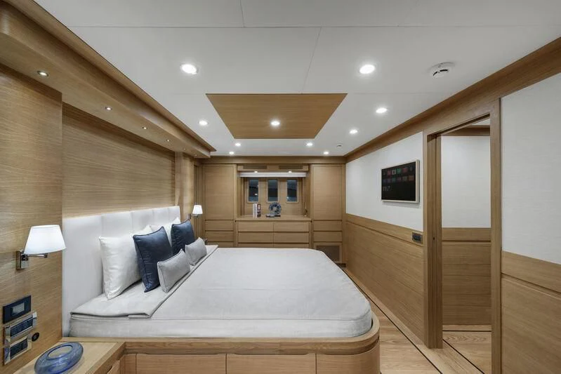 a large bed in a room aboard EMPIRE Yacht for Sale