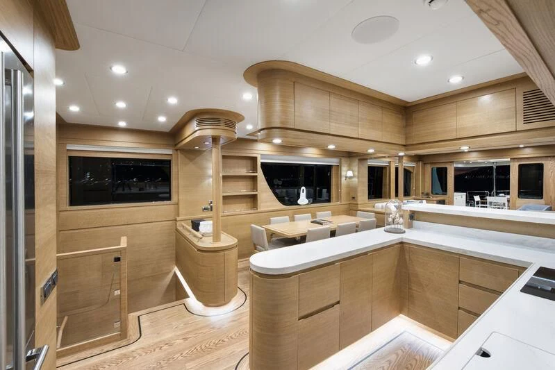 a large kitchen with a large island aboard EMPIRE Yacht for Sale