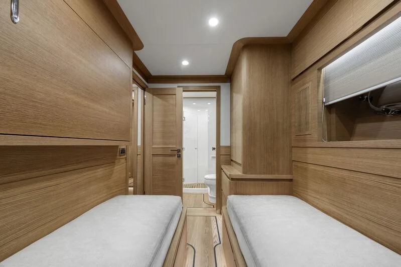 a room with a bed and a closet aboard EMPIRE Yacht for Sale