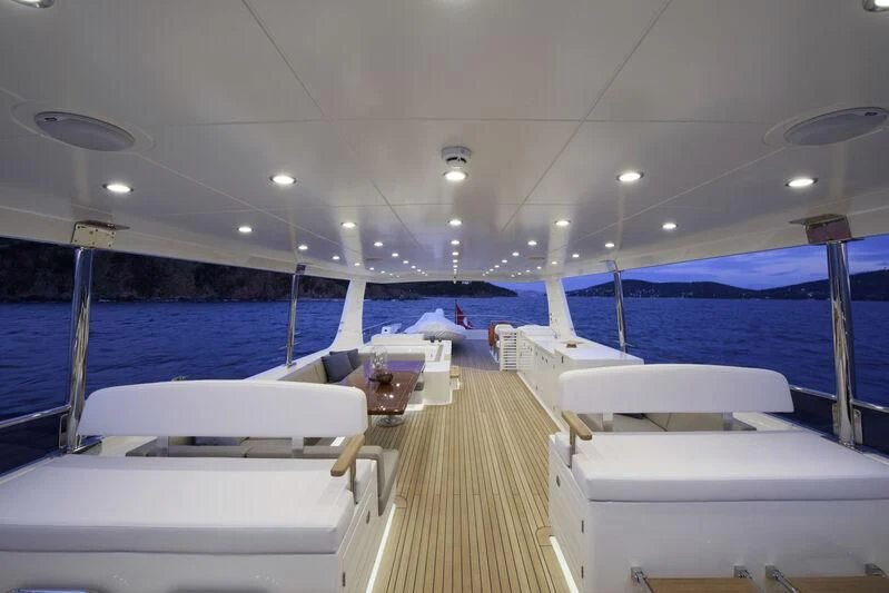 a boat with white beds aboard EMPIRE Yacht for Sale