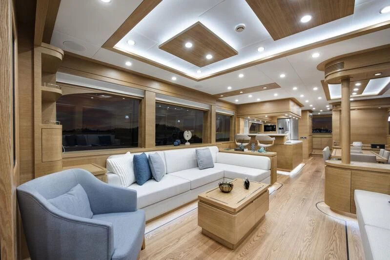 a living room with a couch and a table aboard EMPIRE Yacht for Sale