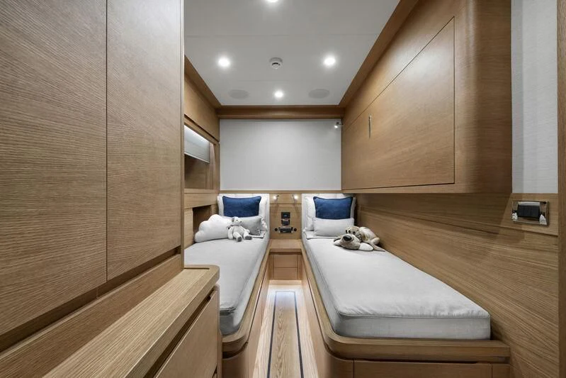a bedroom with a bed and a mirror aboard EMPIRE Yacht for Sale