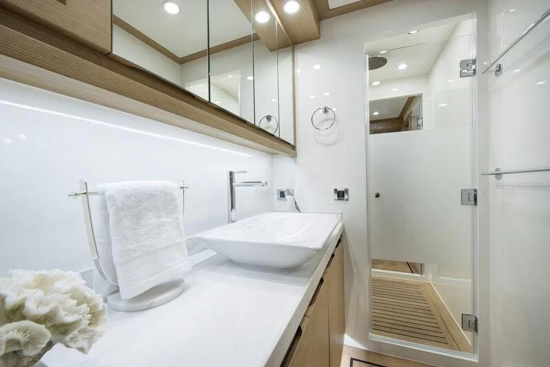 a bathroom with a sink and a mirror aboard EMPIRE Yacht for Sale