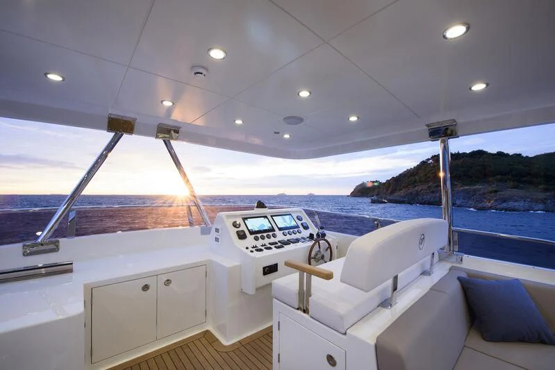 a boat with a deck and a pool in the background aboard EMPIRE Yacht for Sale