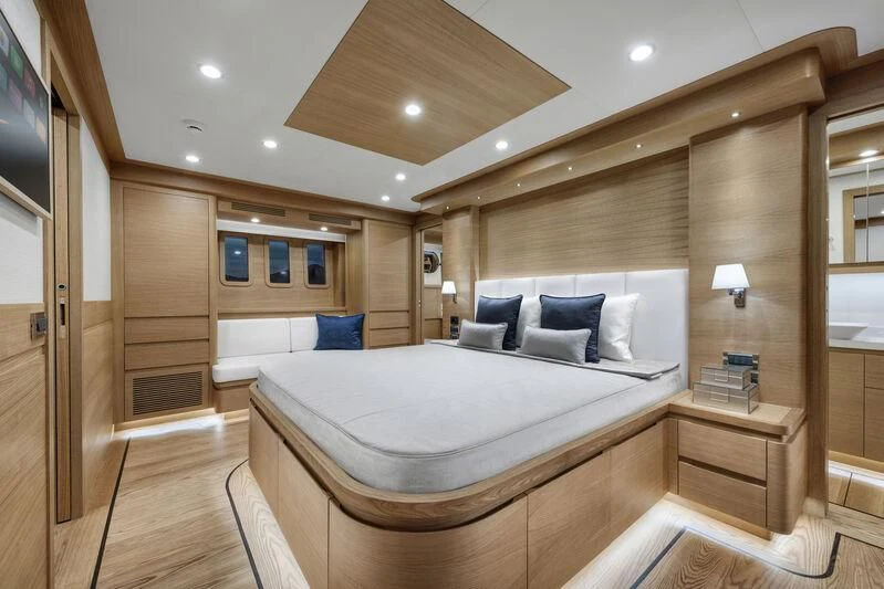 a large bed in a room aboard EMPIRE Yacht for Sale
