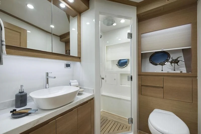 a bathroom with a sink and a toilet aboard EMPIRE Yacht for Sale