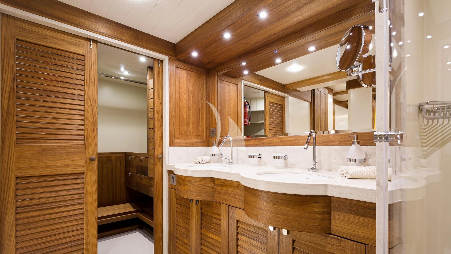 a bathroom with a sink and a mirror aboard MALCOLM MILLER Yacht for Sale