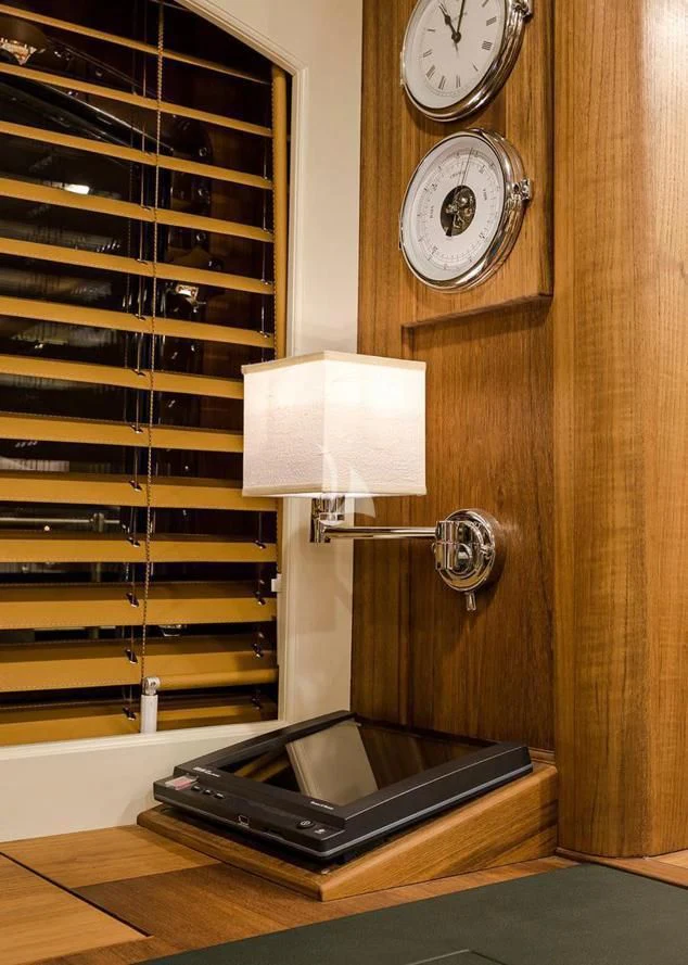 a clock and a lamp in a room aboard MALCOLM MILLER Yacht for Sale