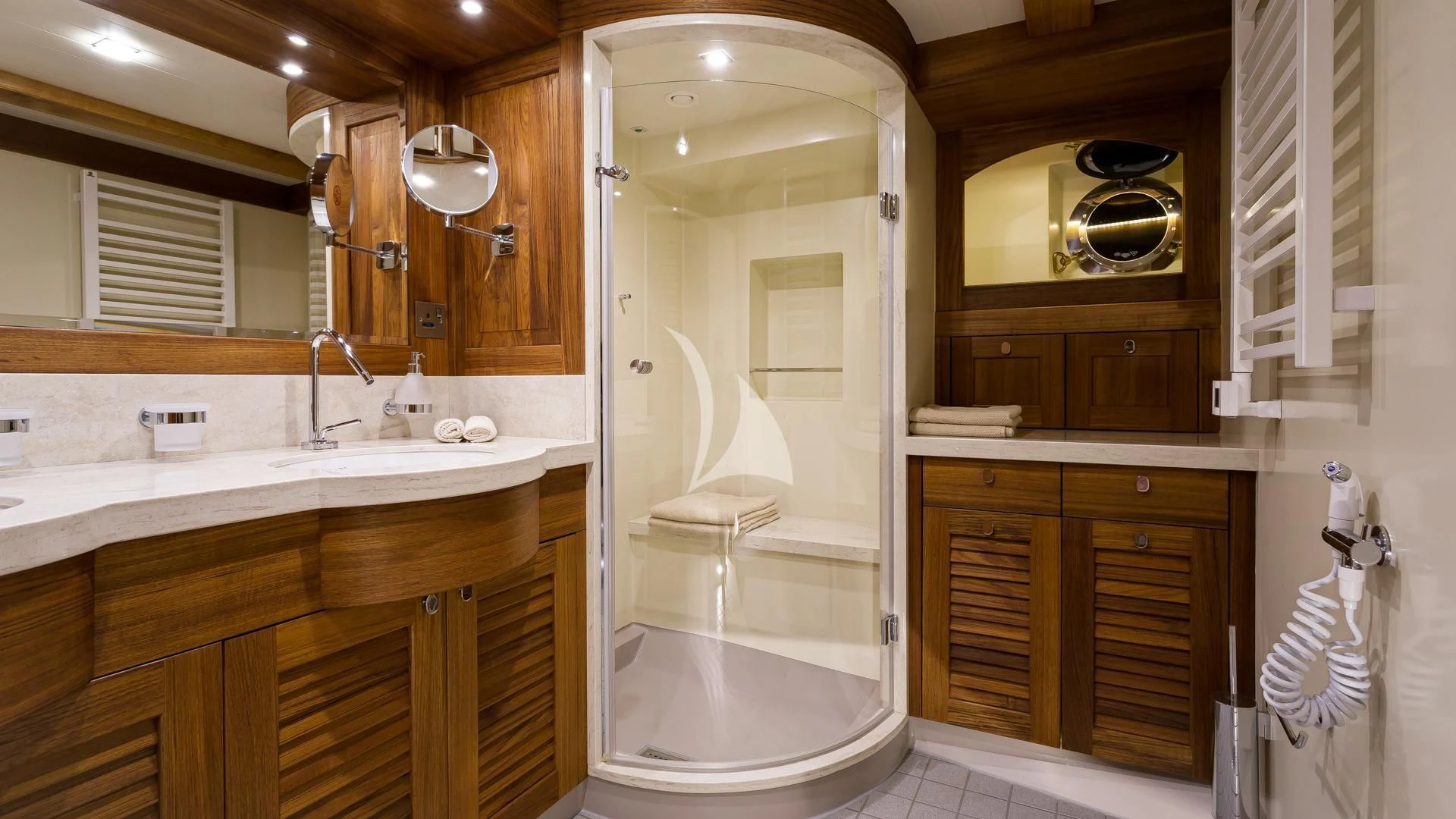 a bathroom with a large mirror aboard MALCOLM MILLER Yacht for Sale