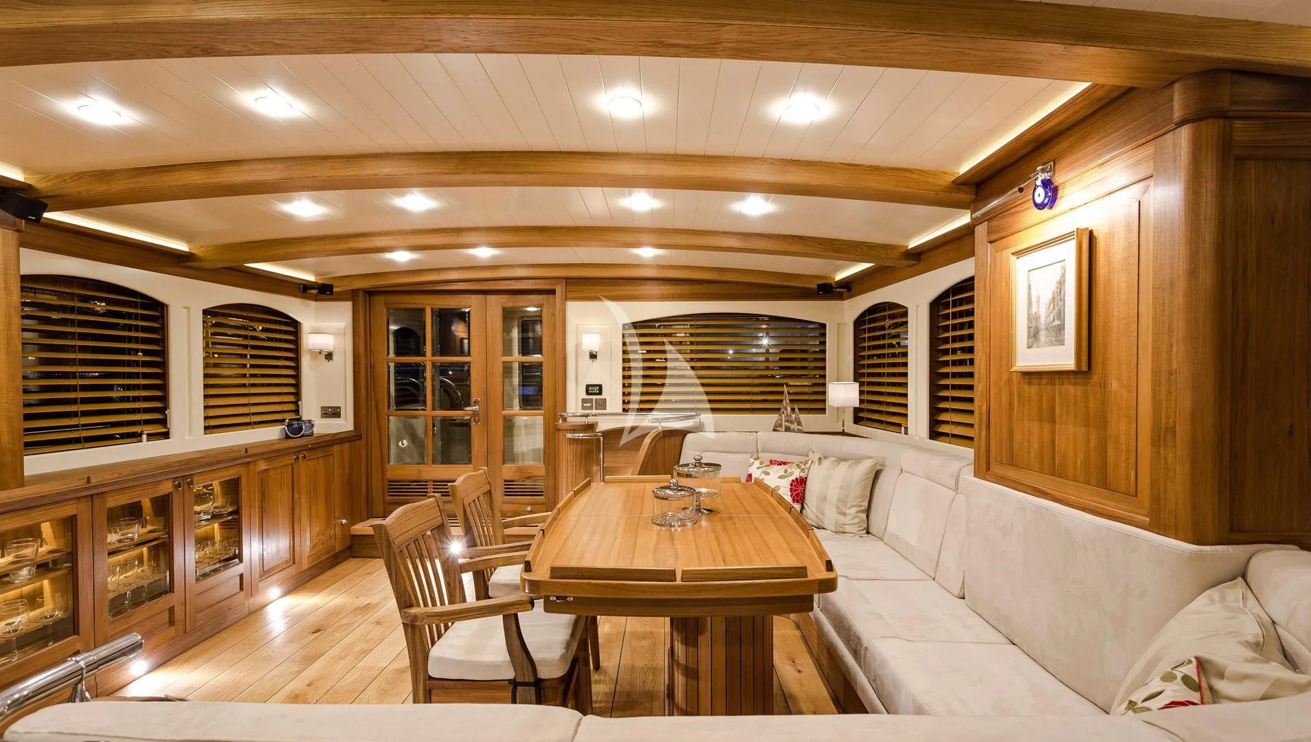 a living room with a couch and a table aboard MALCOLM MILLER Yacht for Sale