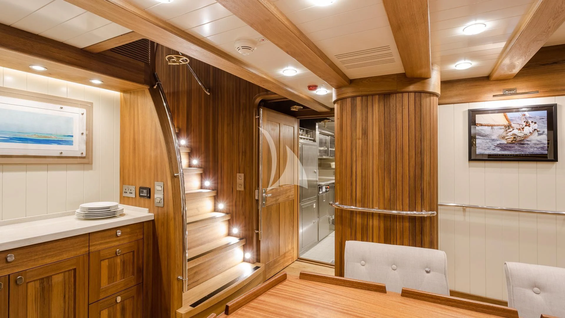 a room with wooden cabinets and a wood floor aboard MALCOLM MILLER Yacht for Sale