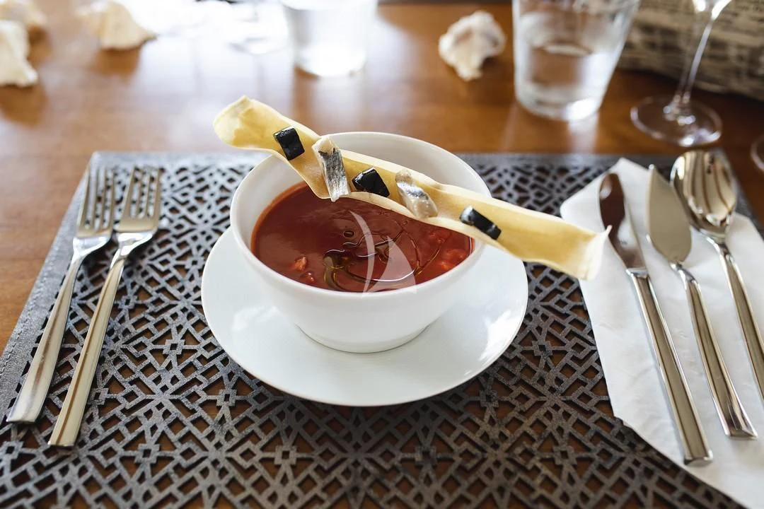 a bowl of soup with chopsticks and chopsticks aboard MALCOLM MILLER Yacht for Sale