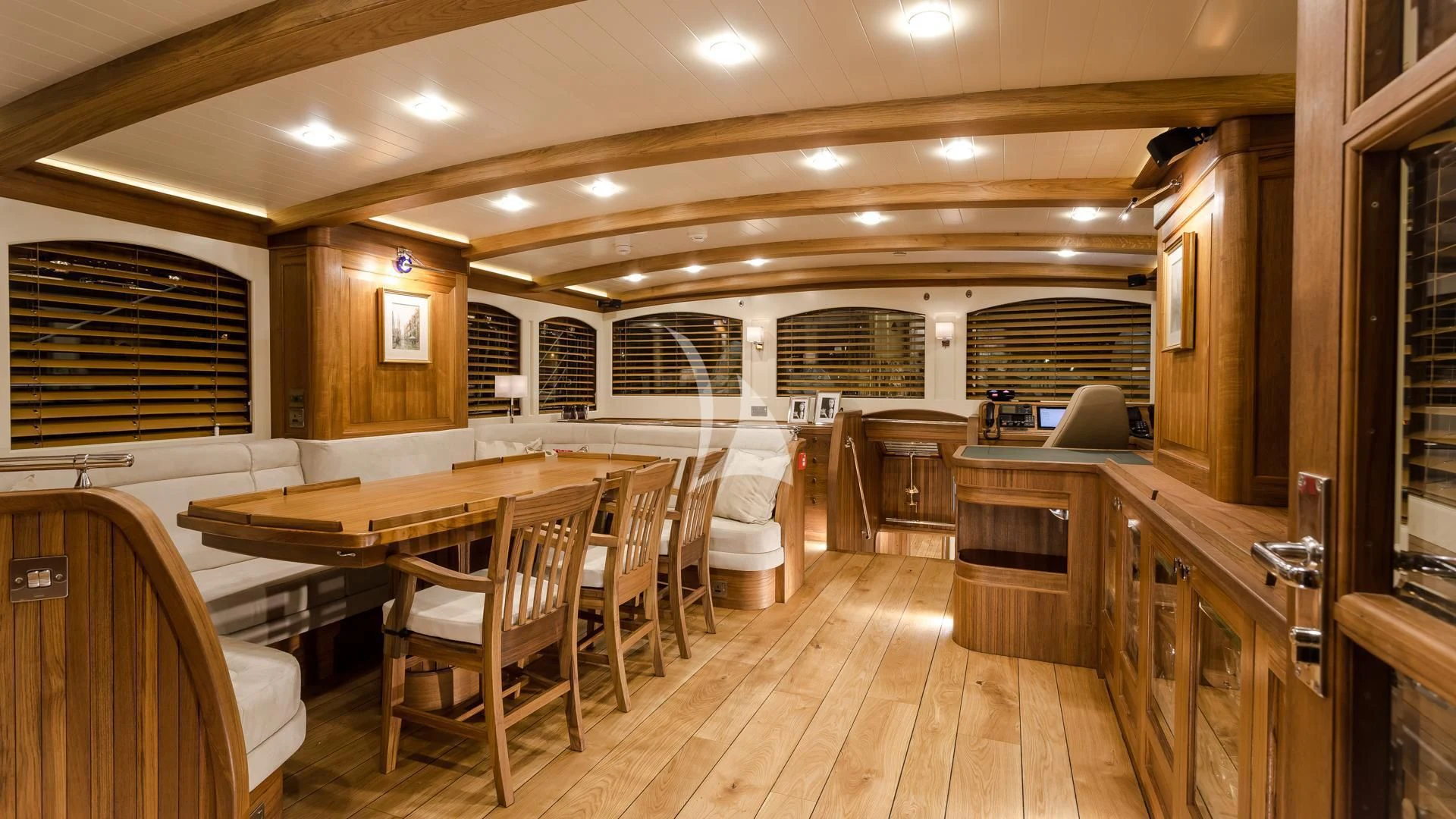 a large kitchen with a dining table aboard MALCOLM MILLER Yacht for Sale