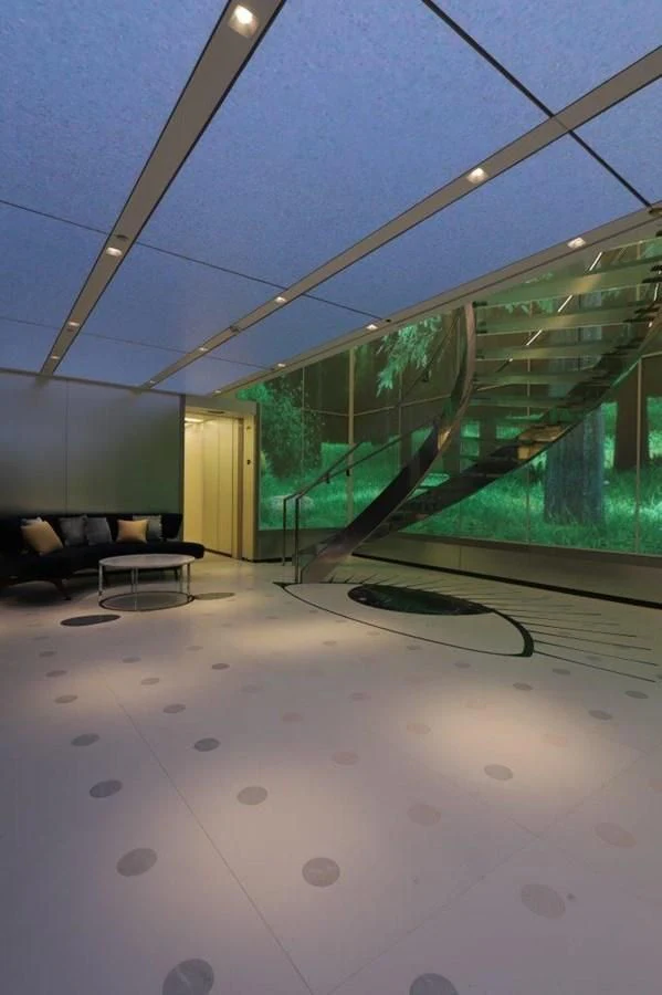 a room with a glass wall and a glass wall with a glass window aboard LUMINOSITY Yacht for Sale