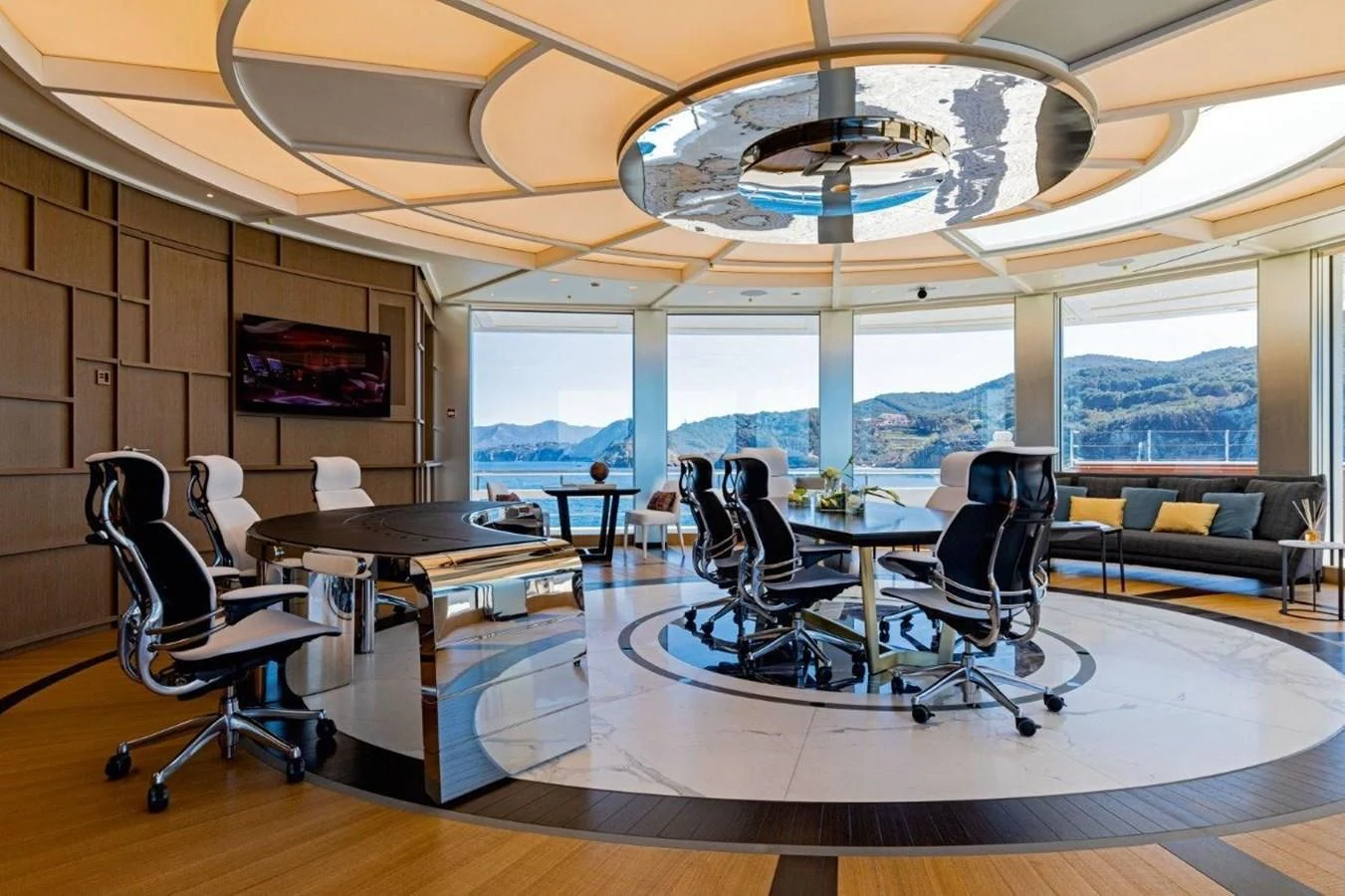 a room with tables and chairs aboard LUMINOSITY Yacht for Sale