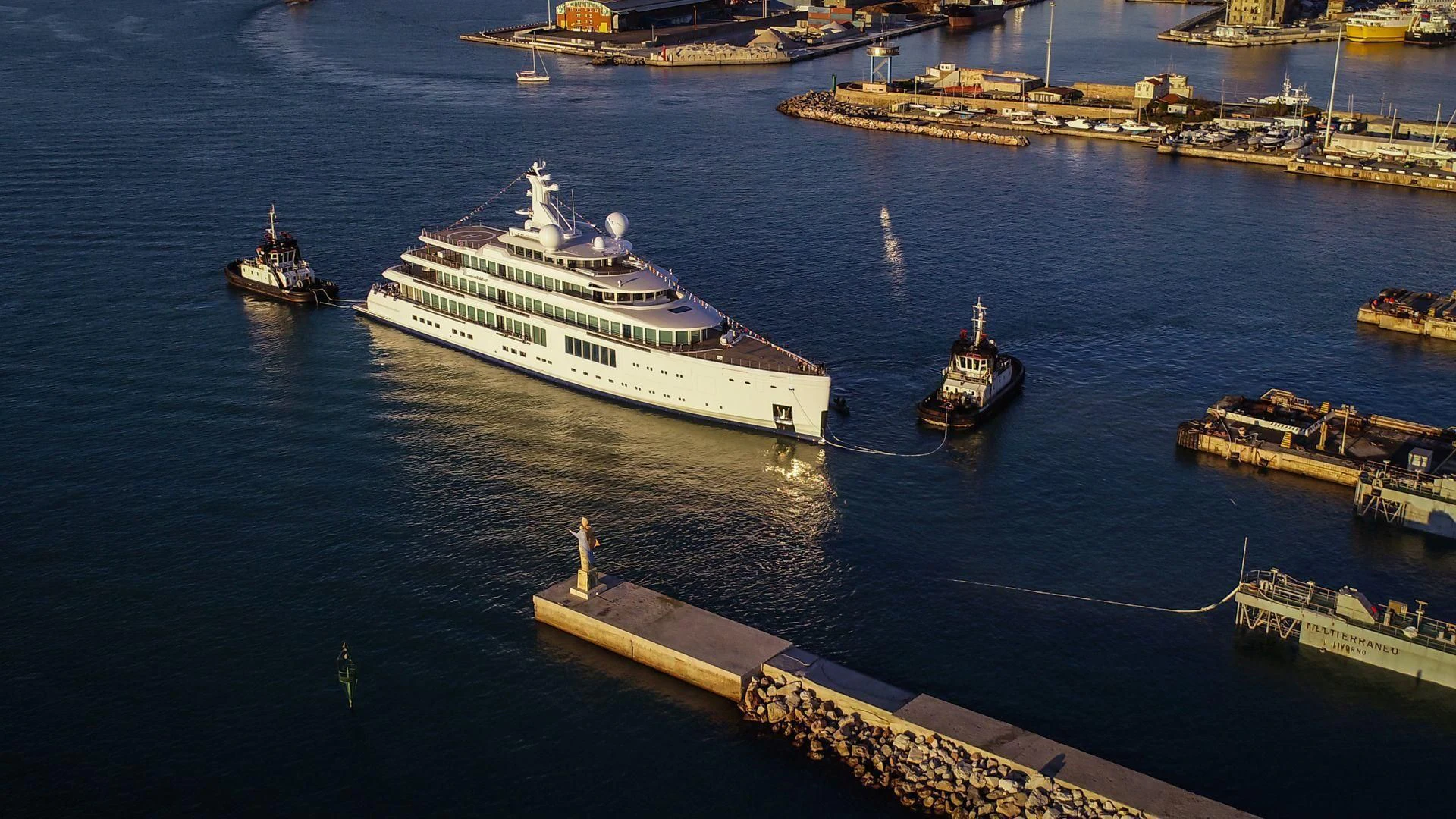 a large ship in the water aboard LUMINOSITY Yacht for Sale