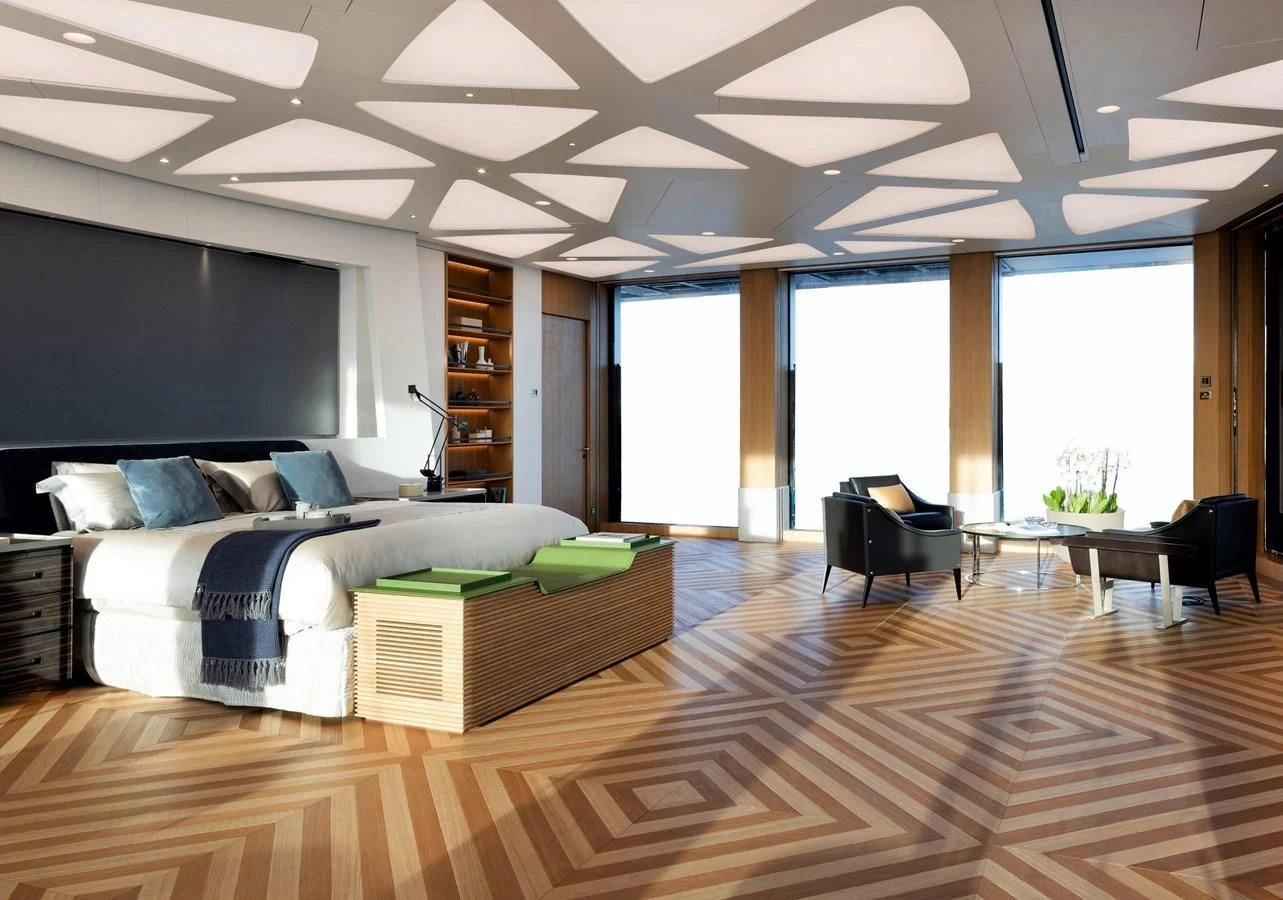 a large room with a couch and a table aboard LUMINOSITY Yacht for Sale