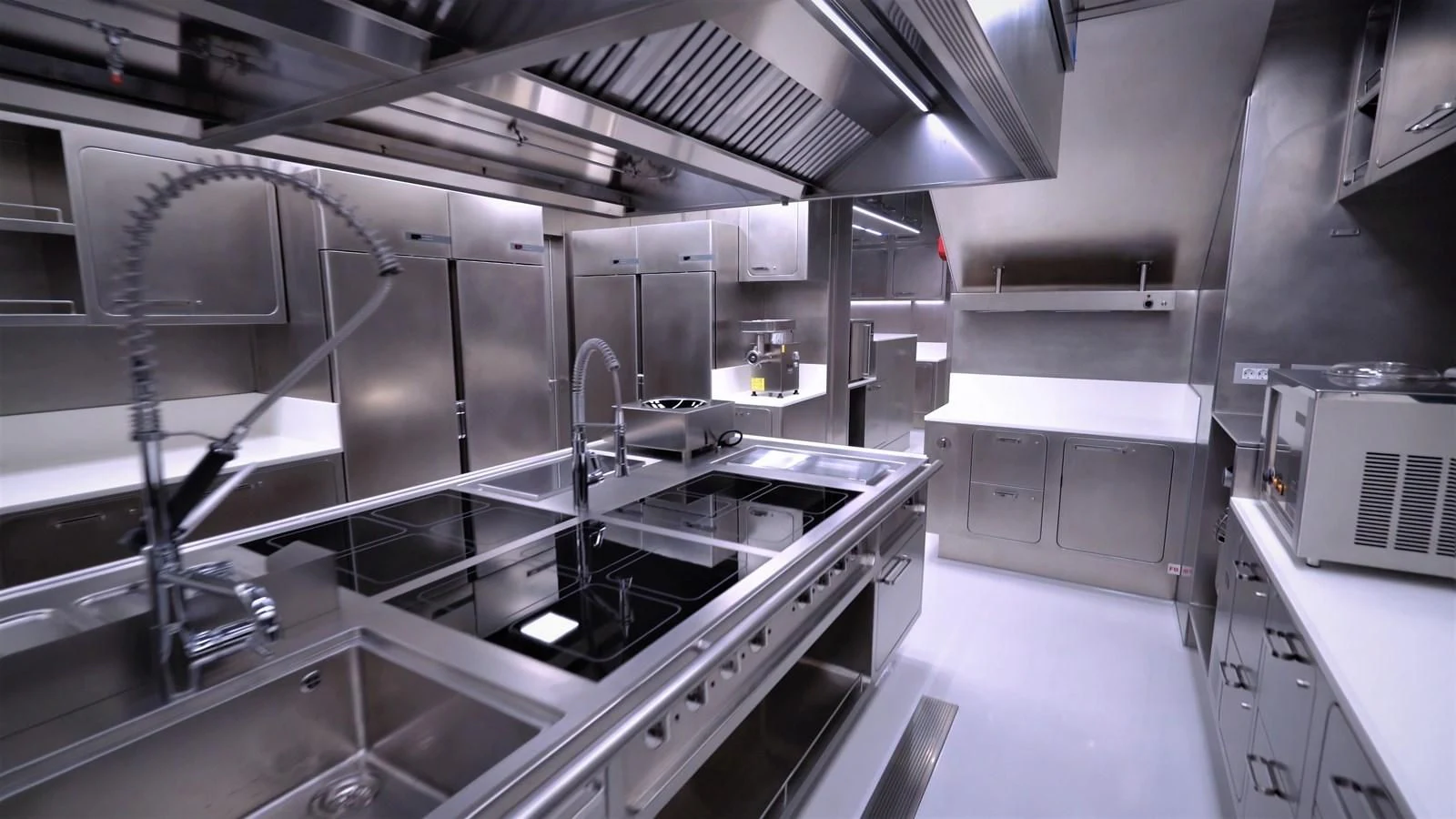 a kitchen with stainless steel appliances aboard LUMINOSITY Yacht for Sale