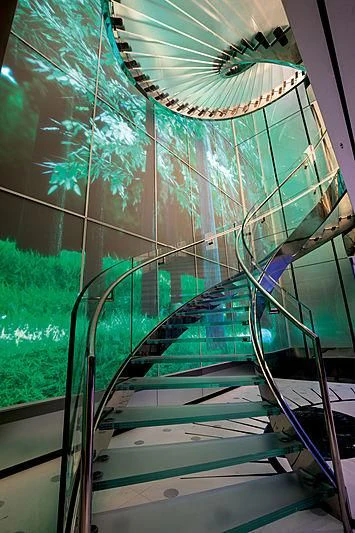 a glass structure with a spiral staircase aboard LUMINOSITY Yacht for Sale