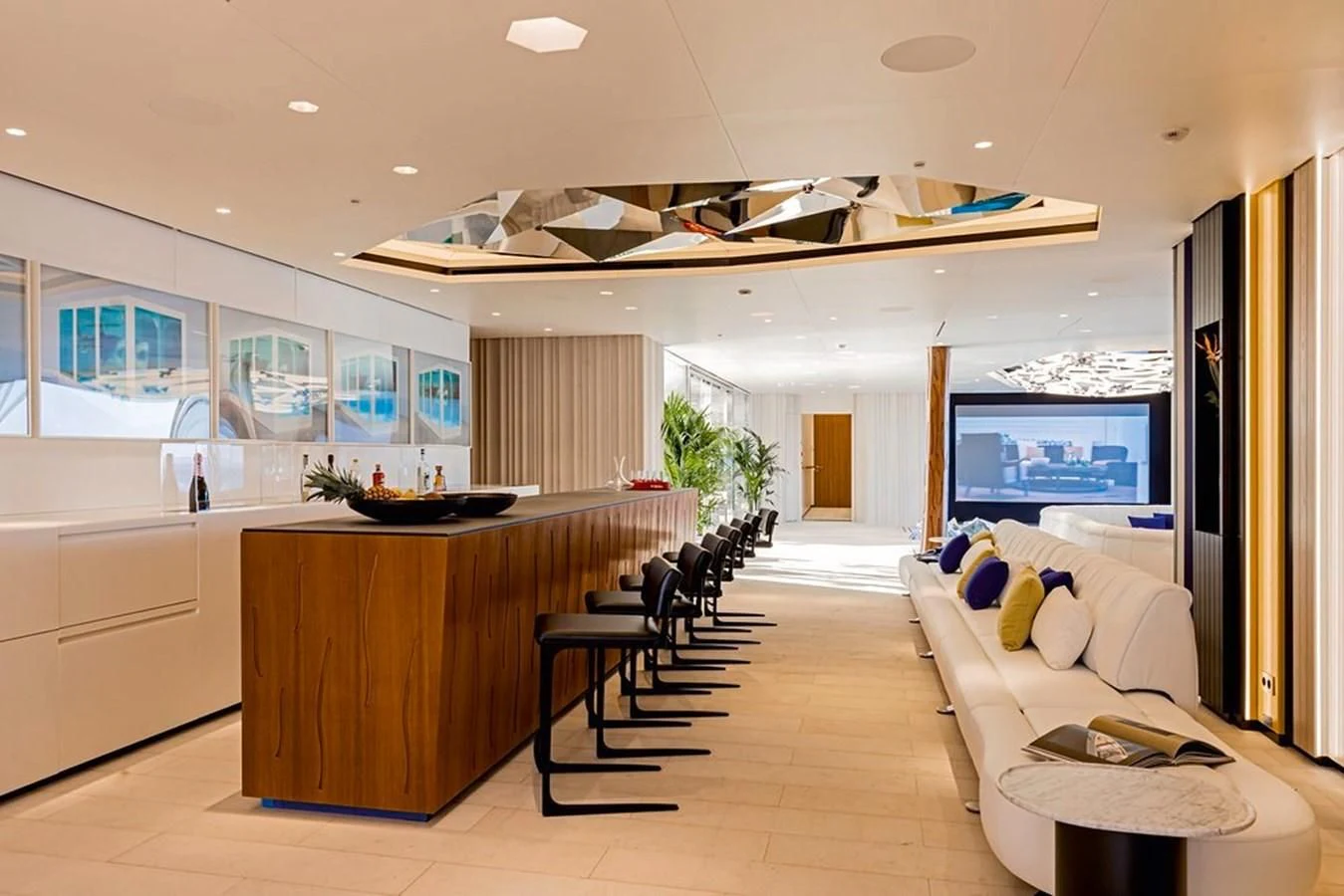 a large living room with a large open floor plan aboard LUMINOSITY Yacht for Sale