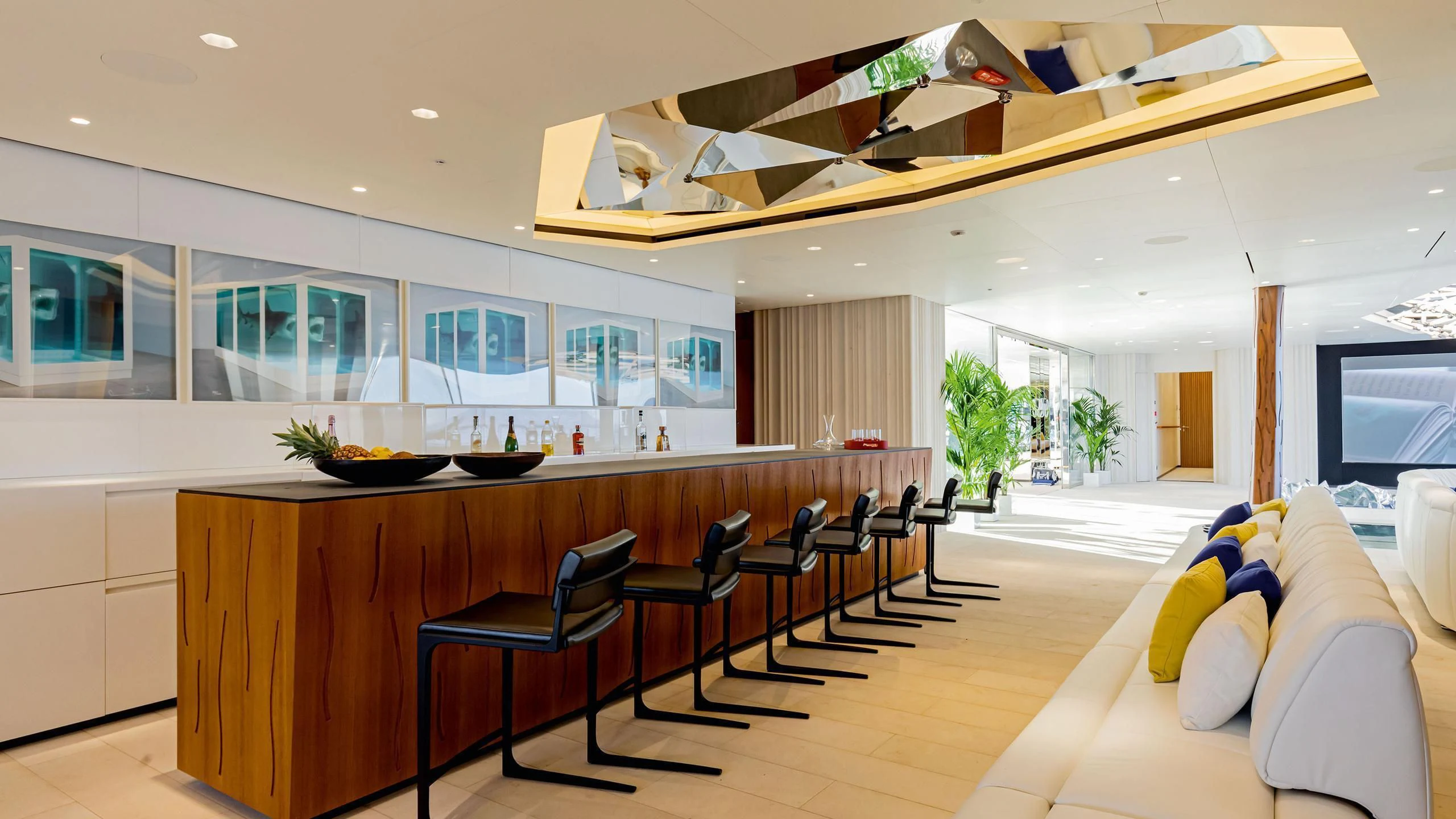 a large room with a large kitchen and living room aboard LUMINOSITY Yacht for Sale