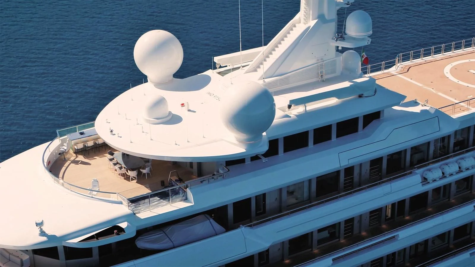 a large white ship on the water aboard LUMINOSITY Yacht for Sale