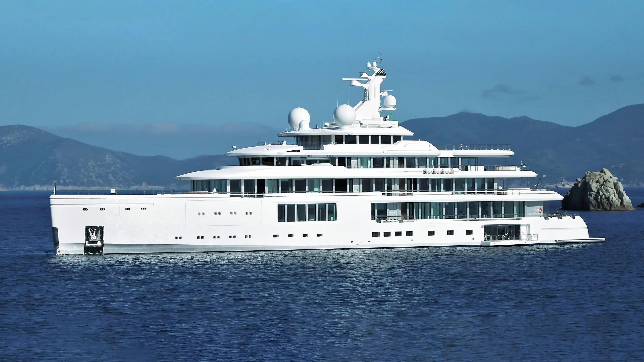 a large white yacht aboard LUMINOSITY Yacht for Sale